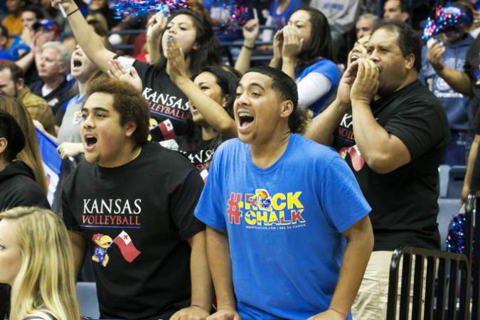 Kansas University's Ainise Havili's relatives cheering as the team wins the first two sets against the University of Southern California in San Diego. 